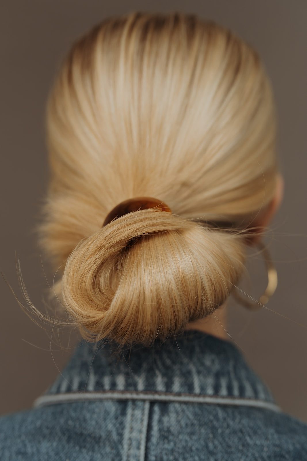 Healthy blonde chignon styled at Bloom Salon